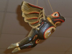 Wooden frog suspended from ceiling