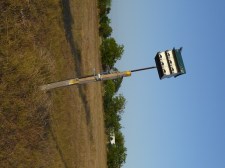 Leaning Purple Martin house