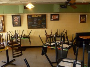 Omelettry (1s) Chairs on top of tables, ready to close the restaurant