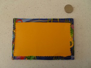 The back of a quilted postcard