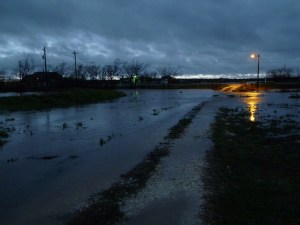 Water flowing over driveway
