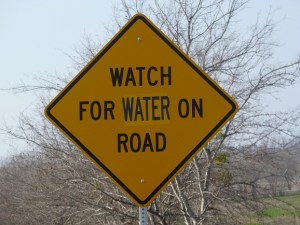 Road sign:  Watch for water on road
