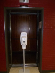 A broken elevator with an open door