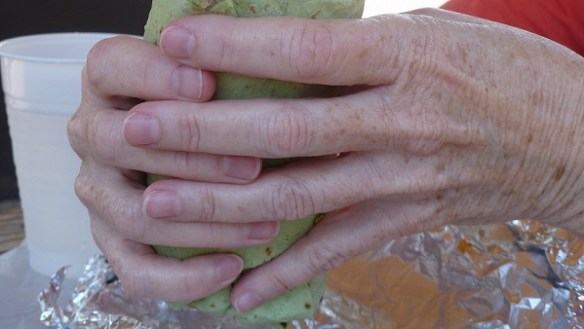 Judy's hands wrapped around a burrito