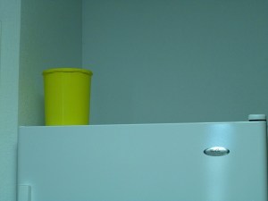 Tupperware canister on top of a refrigerator