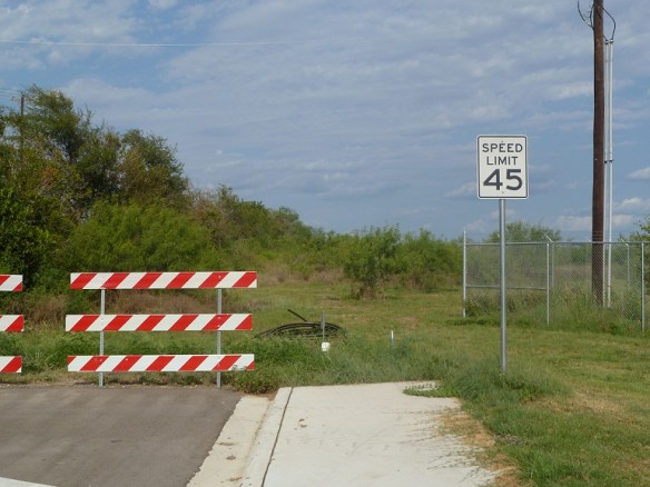 A speed limit sign where the road dead ends