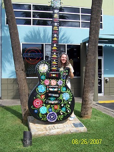 A large, decorated guitar statue to be sold for charity