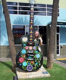A decorated guitar statue to be auctioned off for charity