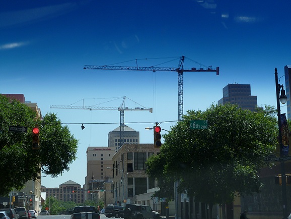 Two construction cranes in downtown Austin, Texas