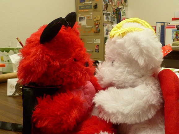 Two stuffed bears kissing