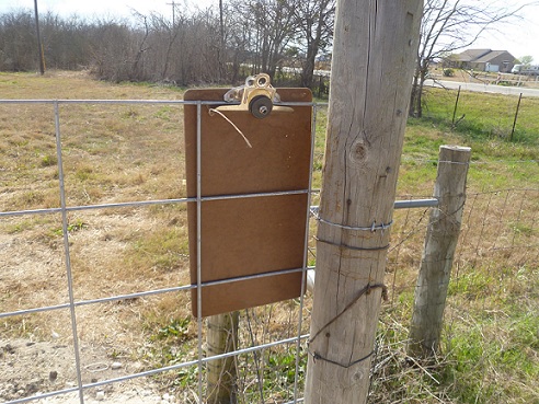 Clipboard on the metal fence