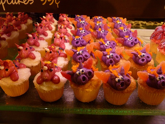 Cupcakes decorated with dragons and unicorns