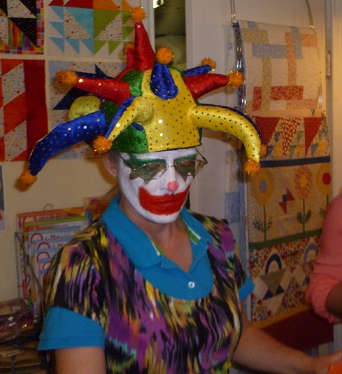 A quilt shop employee dressed up as a jester