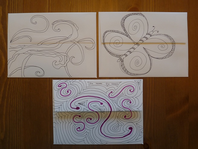 Backs of envelopes decorated with Zentangles