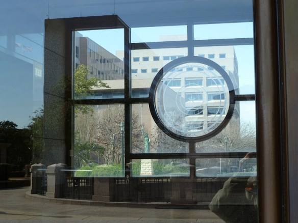 A statue seen through windows