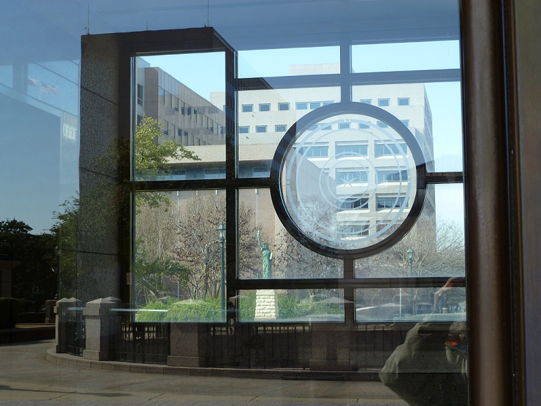 A statue seen through windows