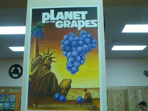 A sign with a pun: Planet of the Grapes; It was fresh produce all along.