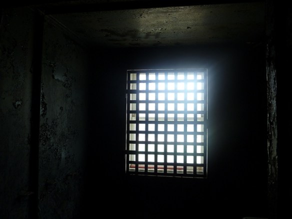 Looking out a jail cell window