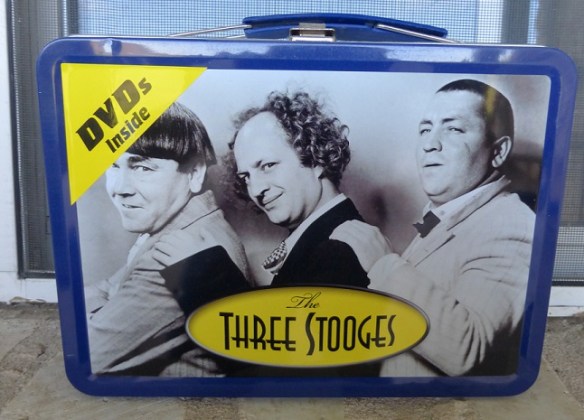 A lunch box with the Three Stooges on the front