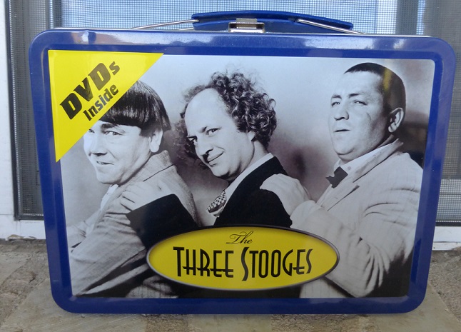 A lunch box with the Three Stooges on the front