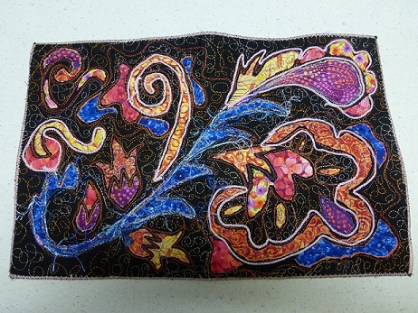 Book cover quilted, embellished and edges sewn