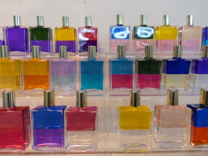 Small gold-capped bottles of many colors