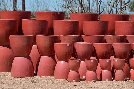 A collection of red pots for plants