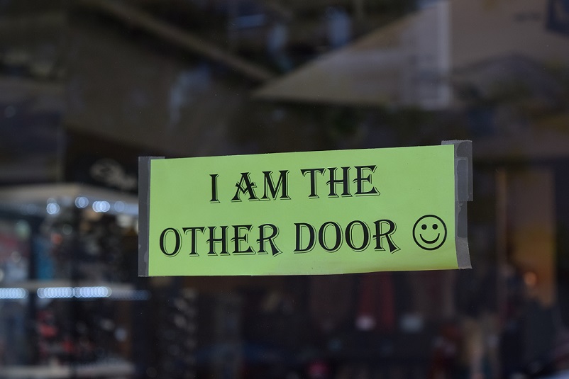 Sign that says "I am the other door"