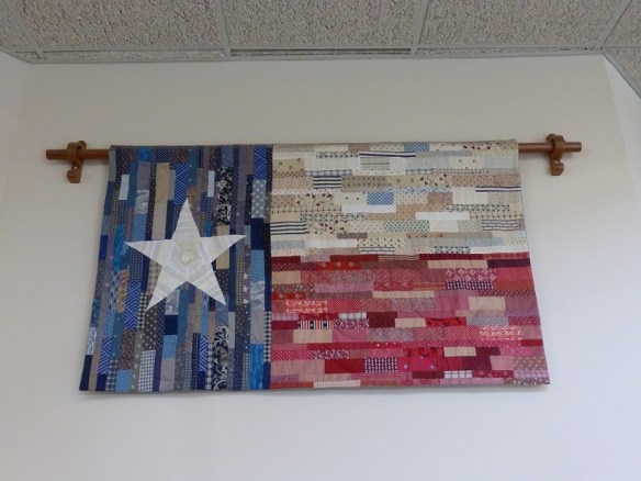 A quilt representing the Texas flag hanging in a city library in Austin, Texas