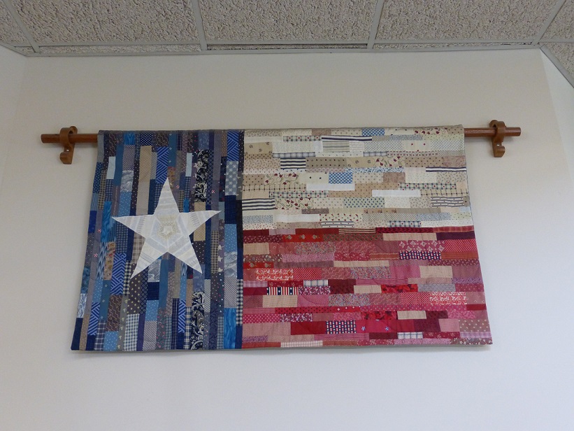 A quilt representing the Texas flag hanging in a city library in Austin, Texas
