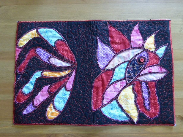 All fabrics cut away and the book cover quilted and bound