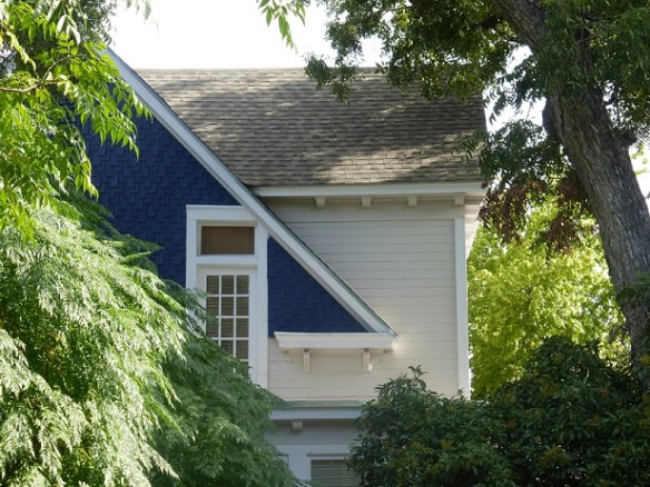 A two-story house with a blue gable