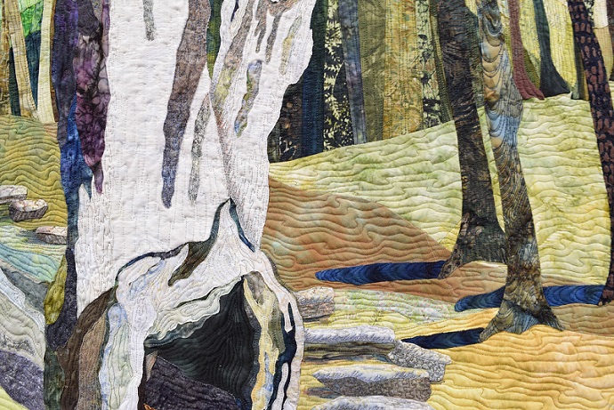 A close up of the Red Tag quilt, showing the fabrics and quilting