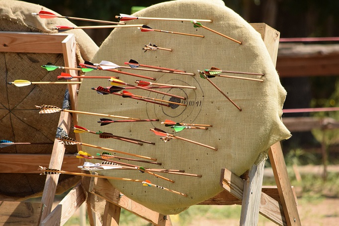 The archery target with all the arrows in it from the volley