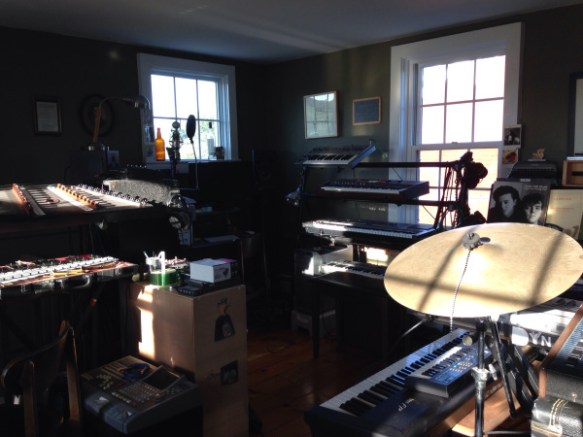 Photo of a music room, filled with several keyboards