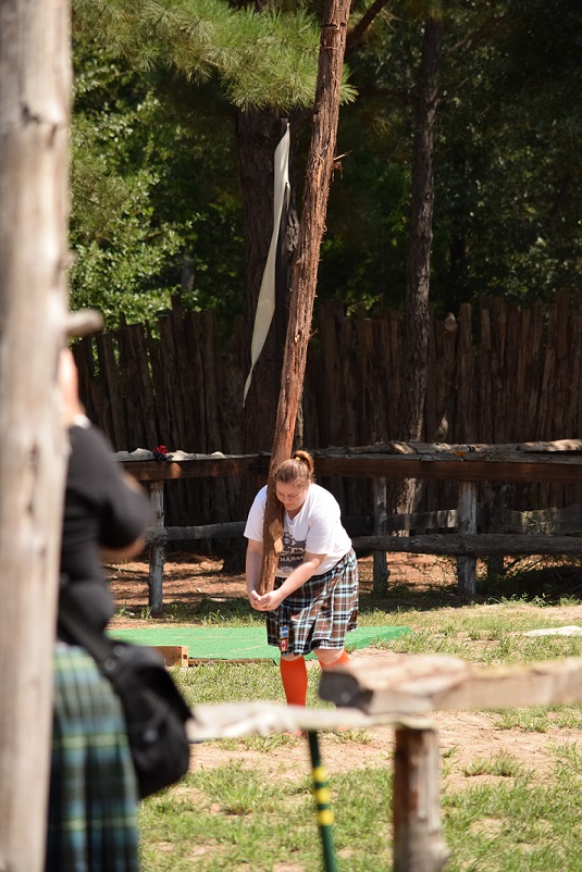 Tammy, holding a caber