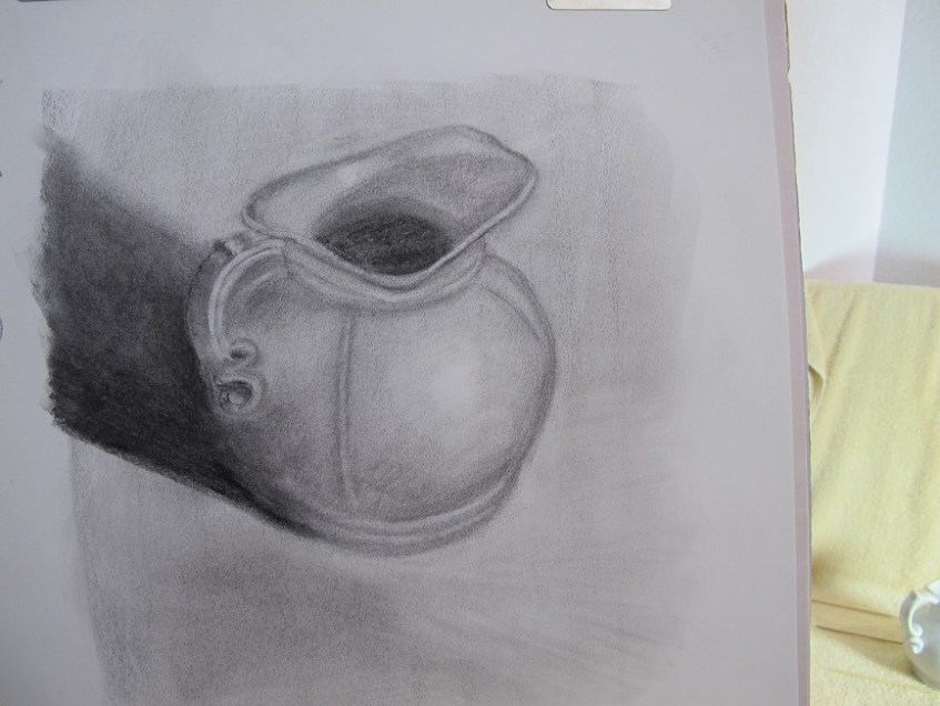 A charcoal sketch of a round-ish pitcher with curlicue handles
