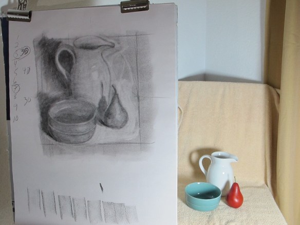 The photo shows both the sketch and the art objects