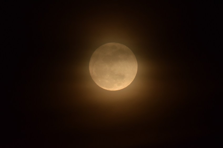 Moonrise through some hazy clouds