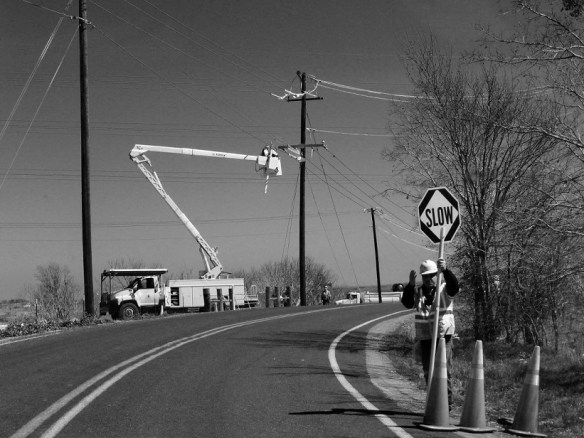 Workers at a curve on a road
