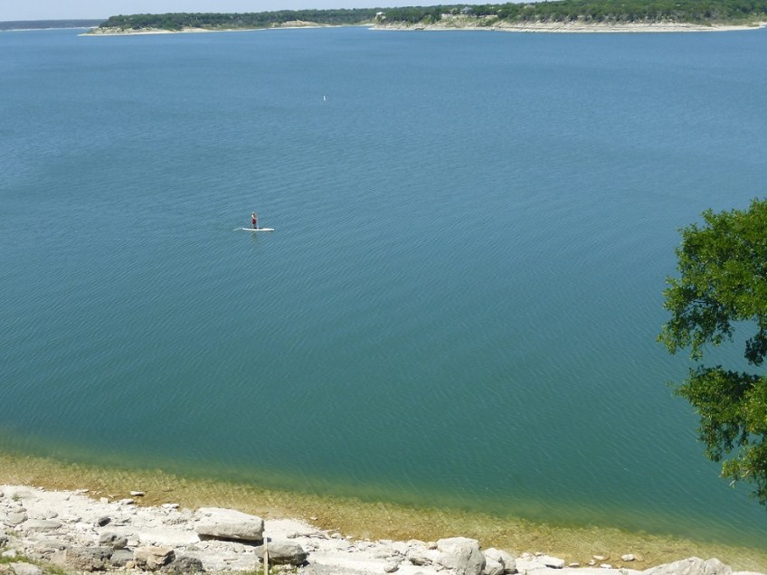 A paddleboarder on Lake Belton, Texas