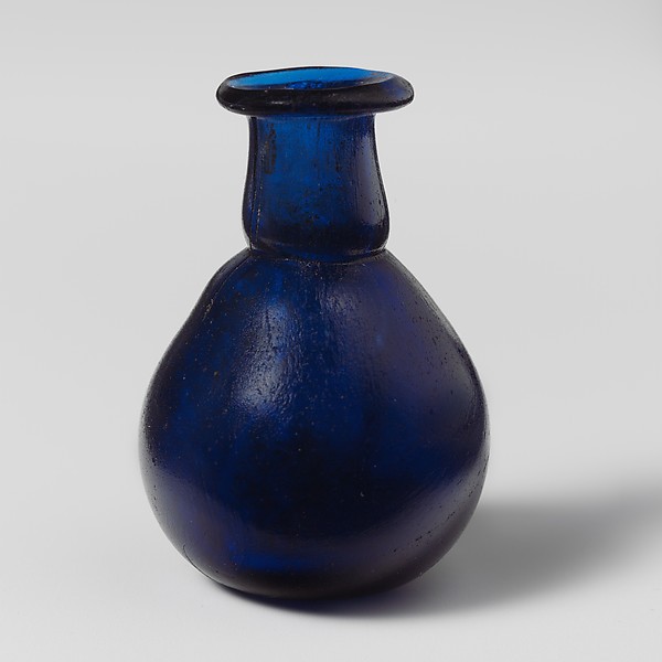 A blue glass perfume bottle