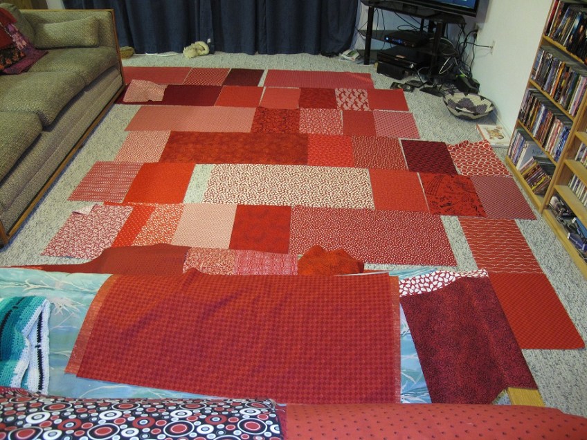 Auditioning fabrics for the quilt back