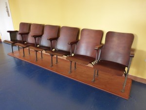 A row of chairs, probably from a Texas courthouse