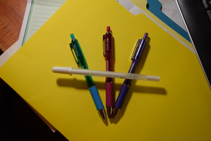 Four pens: one pink, one blue, one purple, one white