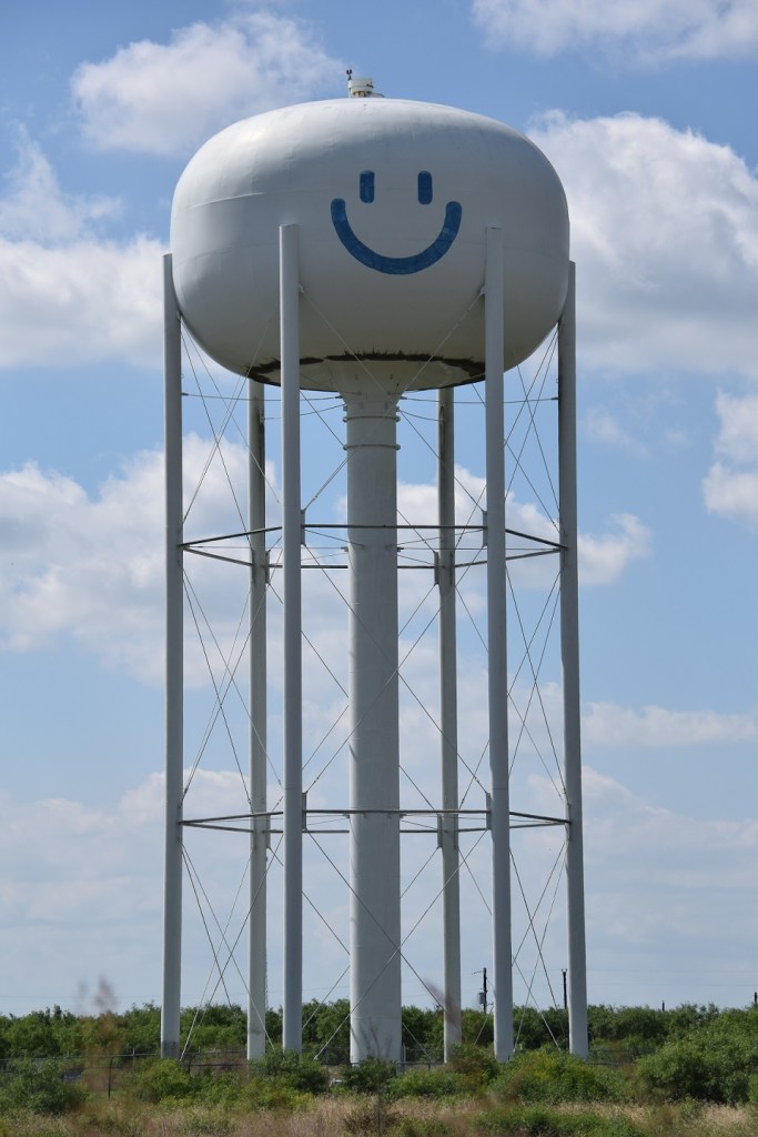 Water tower near Cedar Creek, Texas; water tower has a smiley face on it