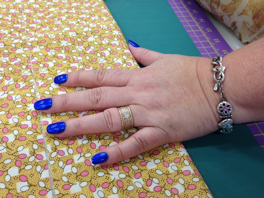 Fingernails with blue nail polish