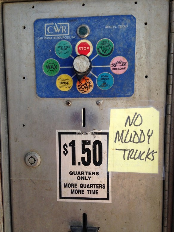 Hand-written sign saying "No Muddy Trucks" at the self-service car wash