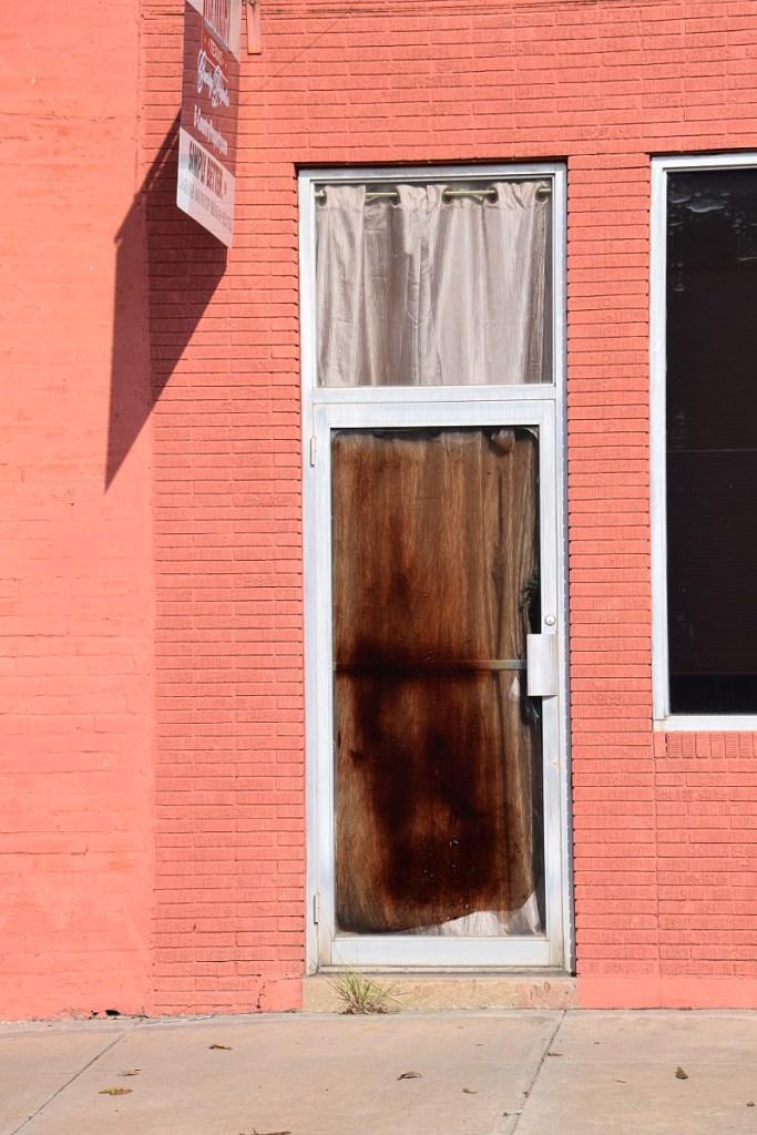 A stained door (curtains?) in La Grange, Texas