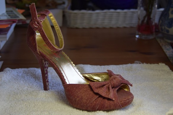 The shoe being sketched and painted.